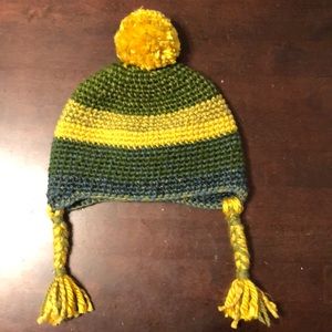 Never worn. Hand made knit winter toddler hat. Colors are yellow, green, blue.